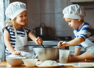 2 children baking in the kitchen